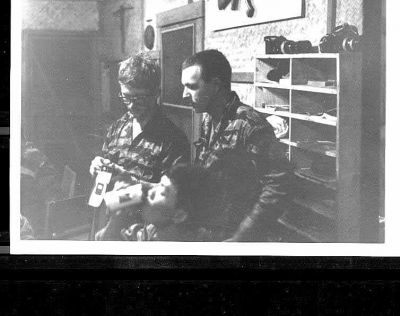 Tom Long and Dana Stone
Dana Stone was a new freelance photographer. This is his first 35mm SLR. I am showing him how to load it.
