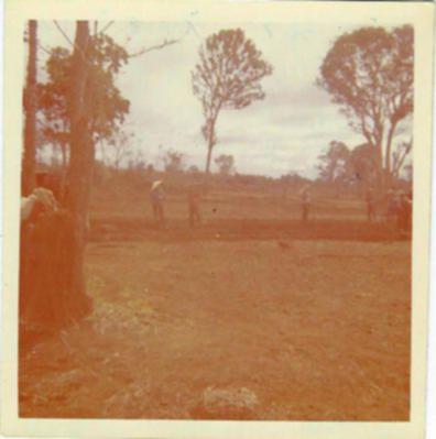 Camp Construction B-50, Ban Me Thout, Dec 1967
Leveling sites for US billets with asssitance from 31st Engr Det grader. SSG Partain (squatting in tiger fatigues) with foreman deciding where more dirt is needed and checking level.
Keywords: CCS, B-50, 31st Engineer Detachment, Ban Me Thout