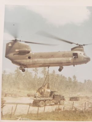 20230426_A421_CH47
Routine re-supply mission by CH47 Chinook. Palletized ammo being dropped into a 5 ton dump truck.  The camp got regularly resupplied with ammo, chow, and beer via CH47. This 5t dump truck later struck a hastily employed AT mine in a road after inserting a US SF/CIDG patrol at a nearby village; two US SF personnel were in the crew cab - neither was injured in the explosion, as only the rear wheels initiated the mine.
Keywords: A421 Resupply;CH47