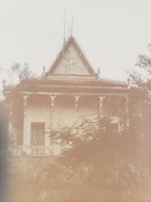 A421 Ba Xoai Buddist Temple
Buddist temple (Wat) located behind (west of) Hill 58/A421 camp proper. Temple was surrounded by CIDG family "hooches" but within the overall camp perimeter. An NVA sapper penetrated the perimeter and took refuge in the temple; CIDG forces killed him by gun fire on the balcony (white balustrade in photo). He was the only on of his 48 man company to penetrate the perimeter.
Keywords: A421 Ba Xoai;Buddist Temple;NVA Sapper KIA